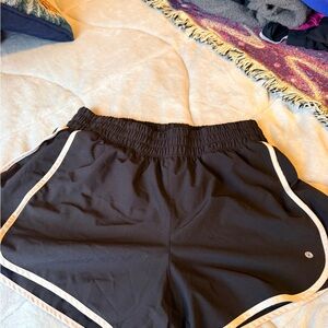 Women's Black Athletic Shorts with white lining and pockets!